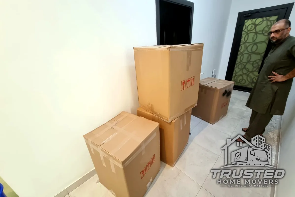 Trusted Home Movers crew with packed and labelled boxes during an apartment move in the UAE