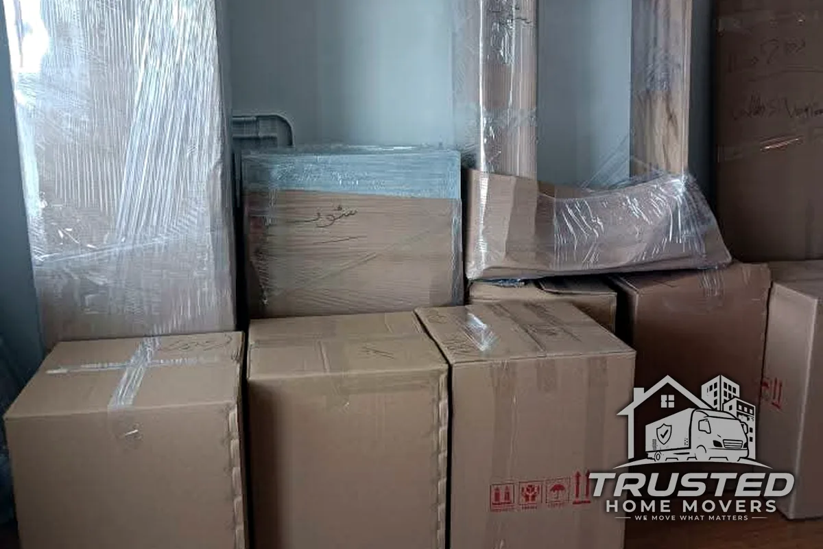 Wrapped mirror and packed boxes ready for transport